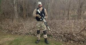 Our airsoft expert Zac with his airsoft gun and gear at Flagswipe Paintball just outside of London, Ontario, Canada.